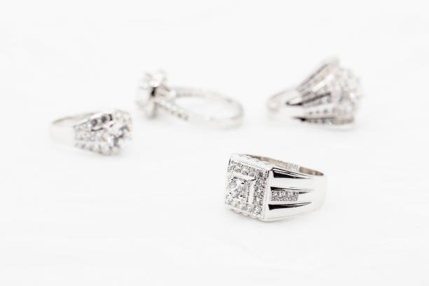 istock Diamond wedding rings on the white. selective focus 833371526