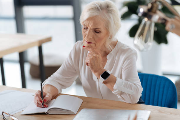 istock Thoughtful smart woman looking at her notebook 833378758