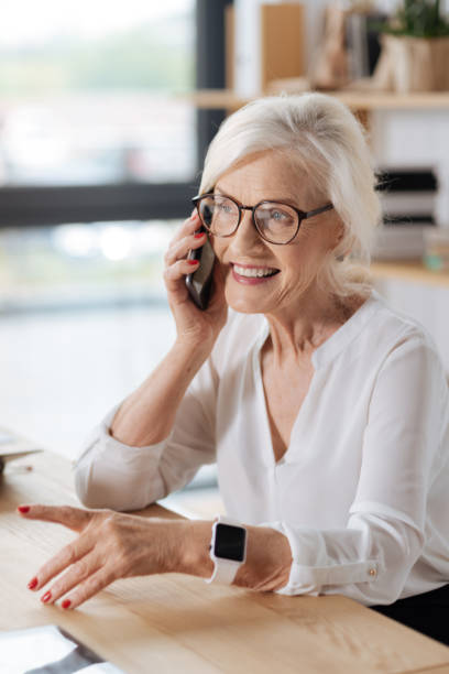 istock Delighted successful businesswoman making a call 833388606