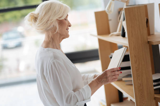istock Happy delighted woman looking at the book 833394858