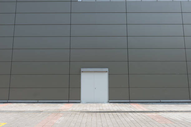 istock sidewalk by street wall & door 833466398