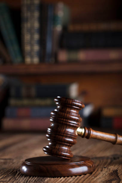 istock Judges gavel. Books. Wooden table 833487876