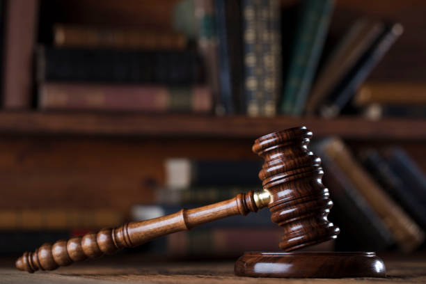 istock Judges gavel. Books. Wooden table 833488628
