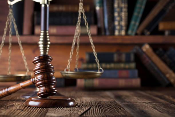 istock Judges gavel. Books. Wooden table 833488630