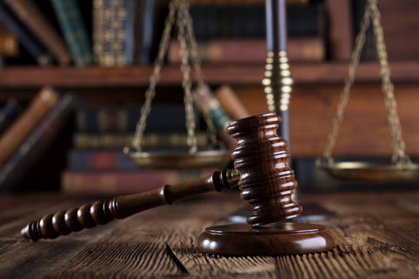 istock Judges gavel. Books. Wooden table 833488636