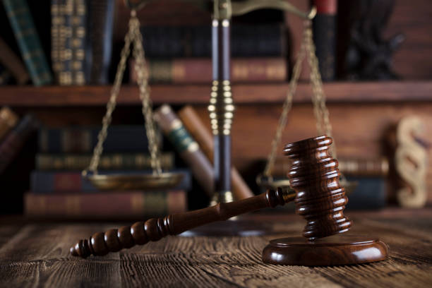 istock Judges gavel. Books. Wooden table 833489128