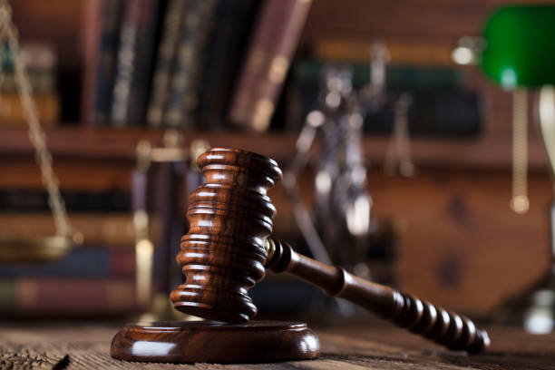 istock Judges gavel. Books. Wooden table 833494074