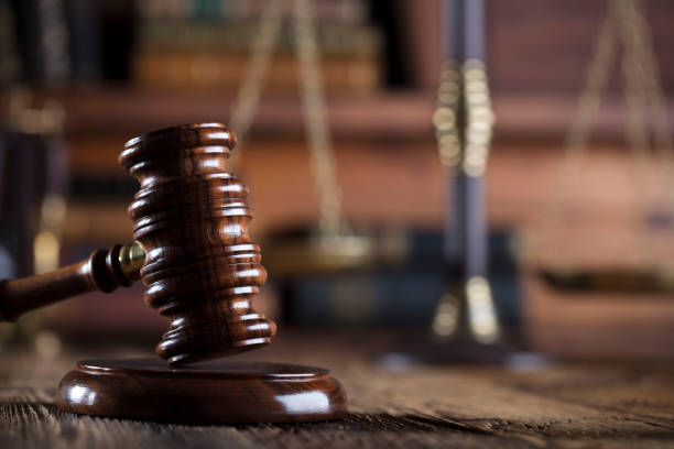 istock Judges gavel. Books. Wooden table 833494076