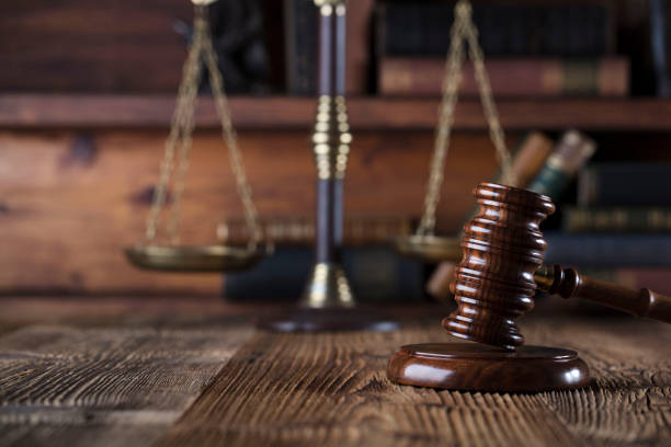 istock Judges gavel. Books. Wooden table 833494080