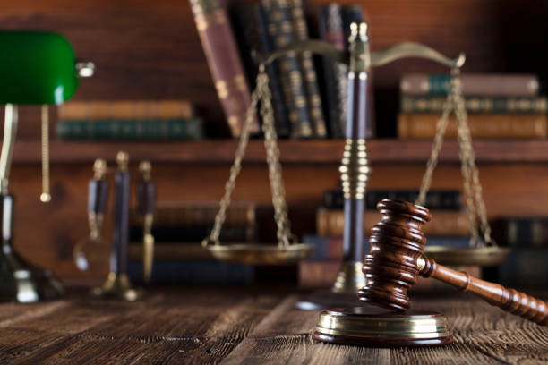 istock Judges gavel. Books. Wooden table 833501528