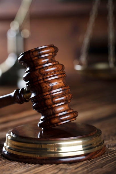 istock Judges gavel. Books. Wooden table 833502942