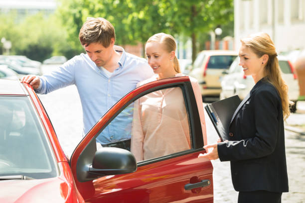 istock Couple Looking At New Car 833509364