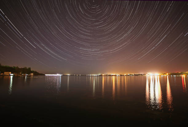 istock tracks of stars in night sky 833512428