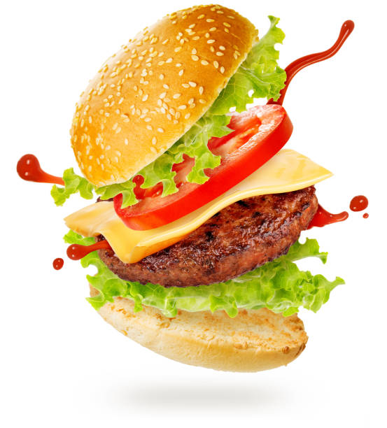 cheeseburger floating on white background - take out food fast food vertical tomato imagens e fotografias de stock