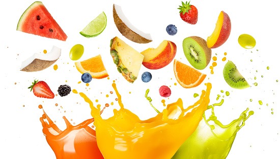 mixed fruit falling in colorful juices splashing on white background