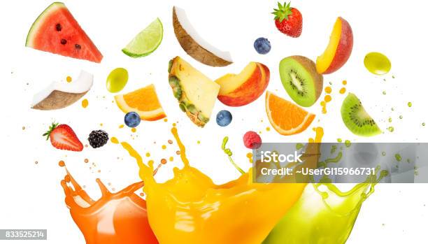 Mixed Fruit Falling In Colorful Juices Splashing Stock Photo - Download Image Now - Fruit, Juice - Drink, Splashing