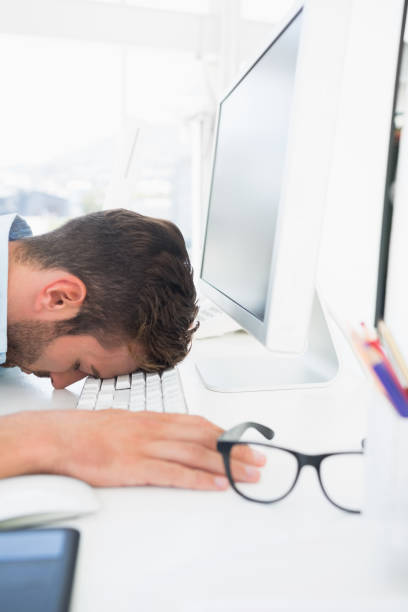 istock Male artist with head resting on keyboard 833529460