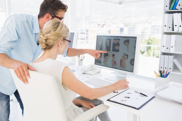 istock Side view of photo editors working on computer 833531386