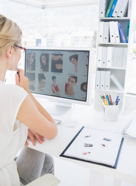 istock Rear view of a female photo editor working on computer 833533032