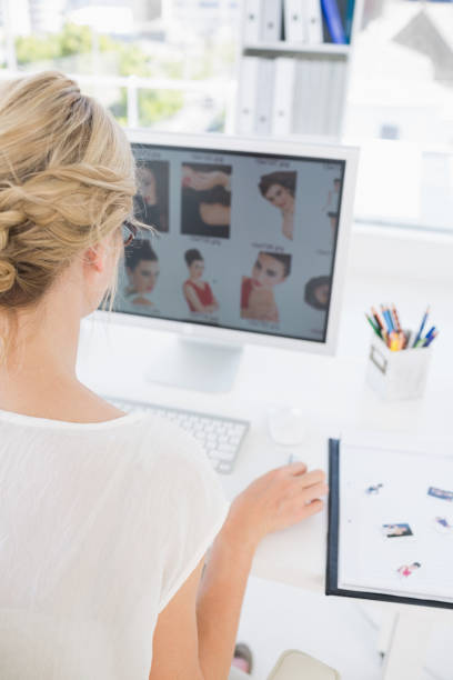 istock Rear view of a female photo editor working on computer 833533120