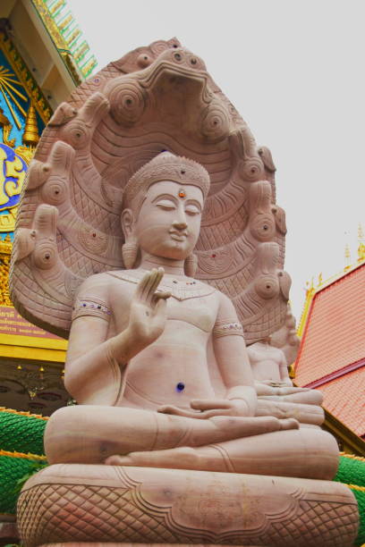istock White stone carving buddha with naga 833533440