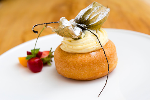A rum baba or baba au rhum is a small yeast cake saturated in syrup made with hard liquor, usually rum, and sometimes filled with whipped cream or pastry cream.