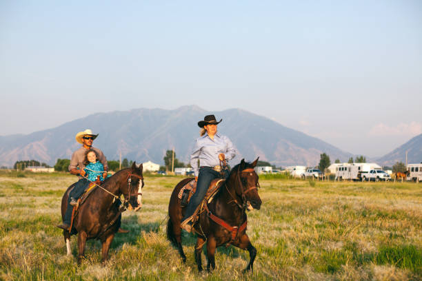 istock family out horse riding 833586022