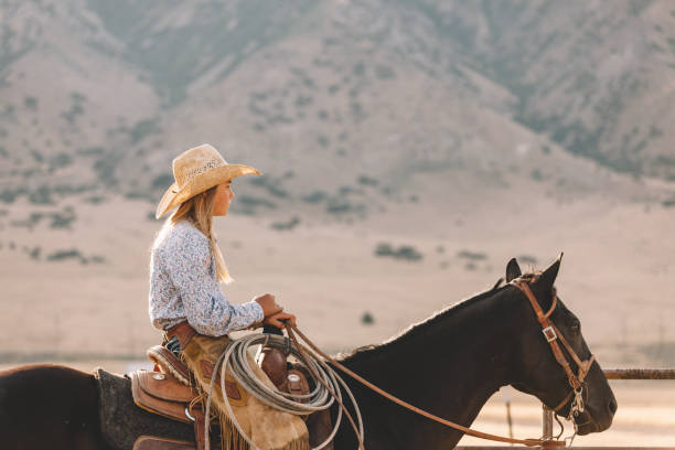 istock female rider on her horse 833600604