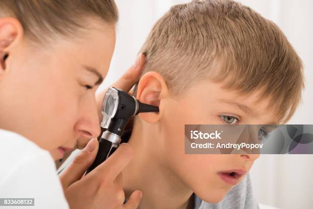 Doctor Examining Boys Ear Stock Photo - Download Image Now - Child, Otolaryngologist, Ear