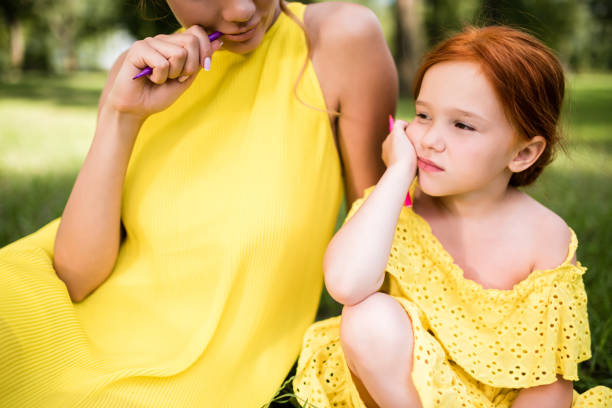 istock mother and daughter drawing at park 833617436