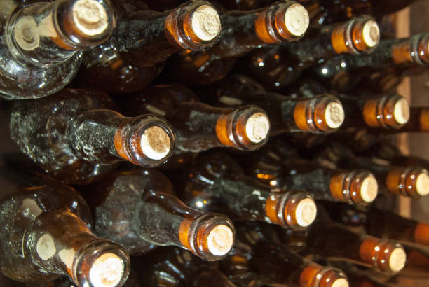 istock bottles with wine stacked in rack 833628648