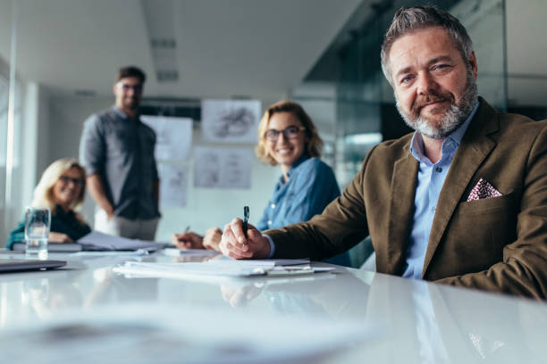 istock Businesspeople looking at camera with smile 833628834