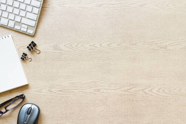 top view wooden office desk with computer and supplies top view wooden office desk with computer and supplies, with copyspace desktop pc stock pictures, royalty-free photos & images