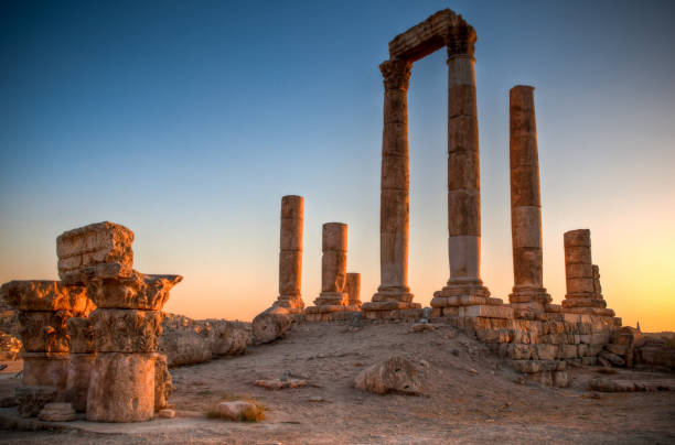 istock ancient ruins with sun and sunset sky in background (Temple of Hercules in Amman, Jordan) 833632536