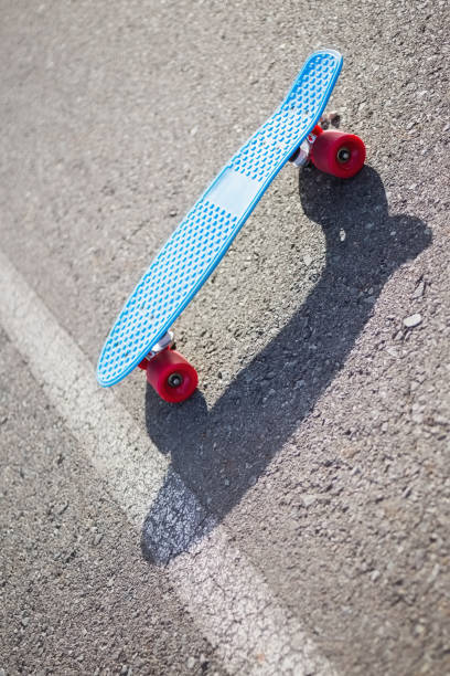 istock Colorful skateboard on a road 833632738