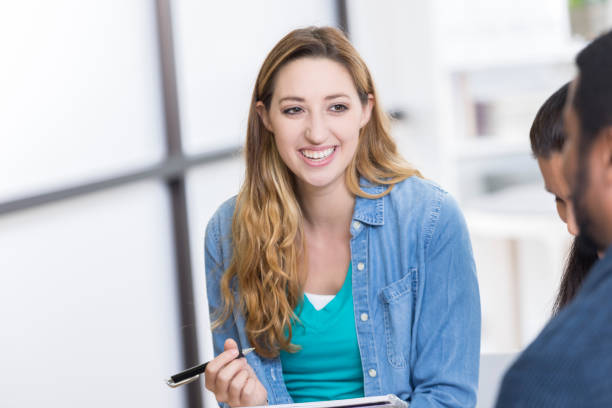 istock Confident female counselor leads discussion group 833665986