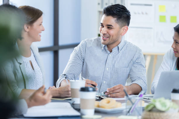 istock Confident businessman leads meeting 833666798
