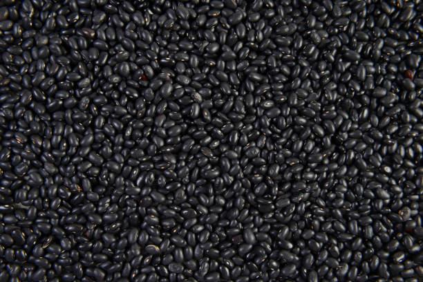 istock Seeds black beans useful for health texture background. 833676902