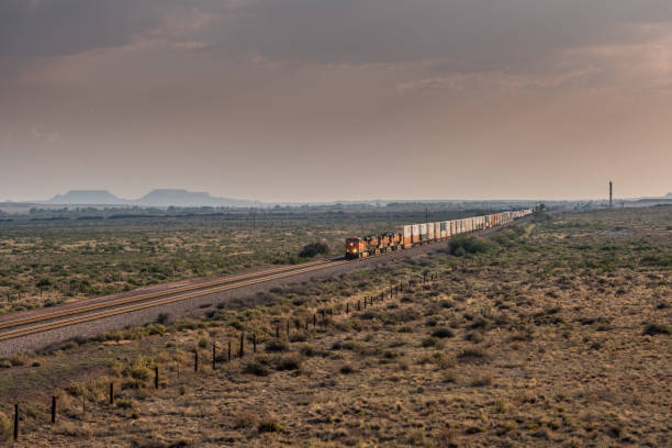 istock Diagonal View of Train Rolling Across Desert 833686522