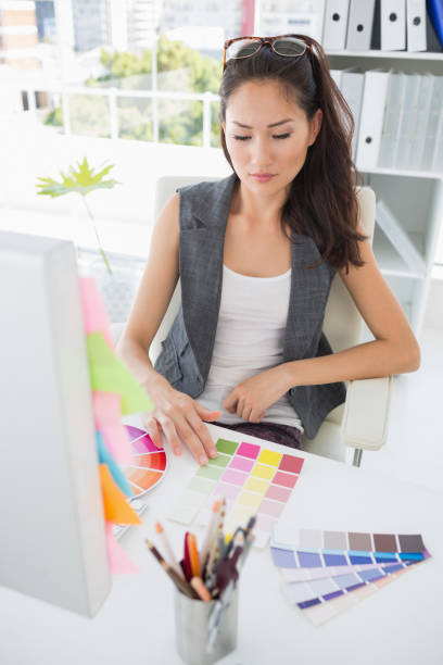istock Concentrated female photo editor at work 833695526