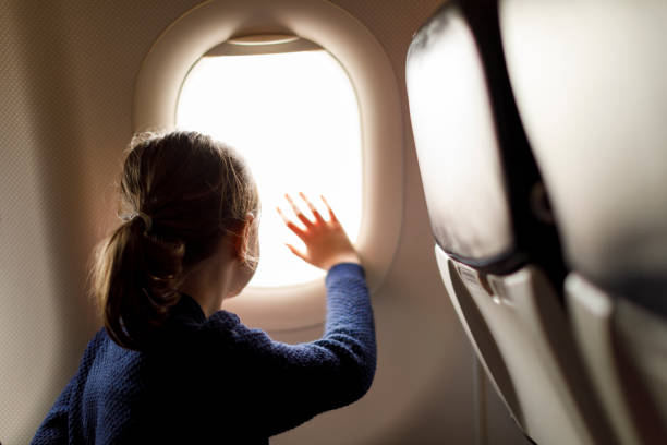 Cute little girl enjoying her flight