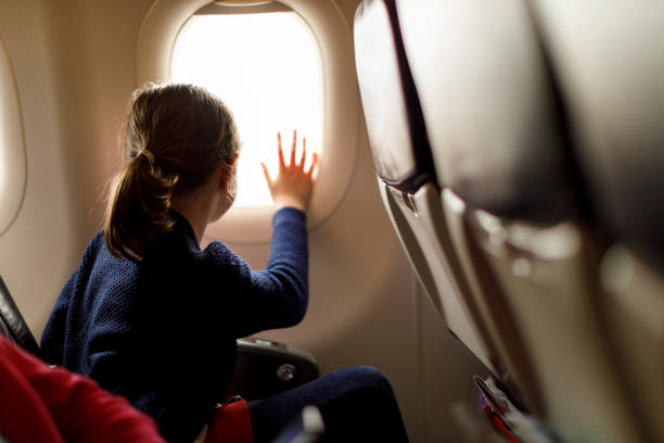 istock Cute little girl enjoying her flight 833697616