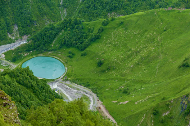 istock A round blue lake is in mountains 833717252