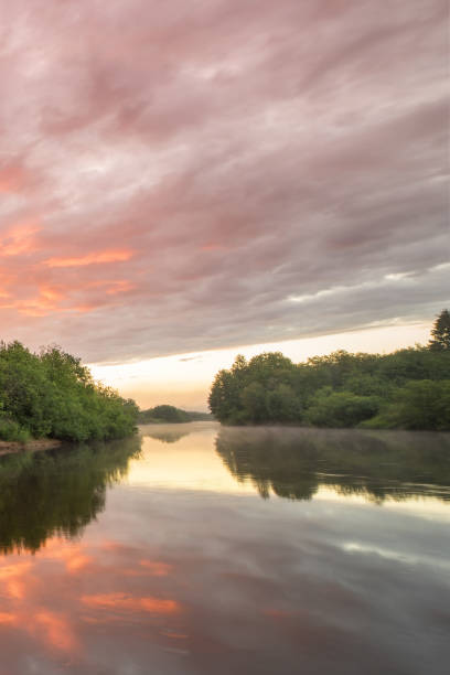 istock Summer landscape scenic fiery sunset over calm river 833722694