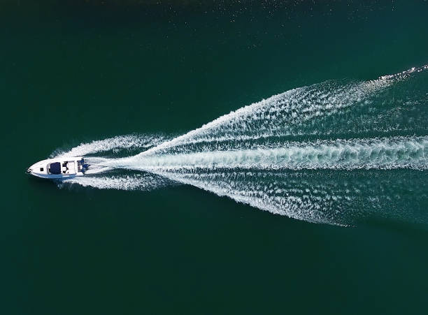 Speedboat aerial view An aerial view of a motor speed yacht boat on lake stock pictures, royalty-free photos & images