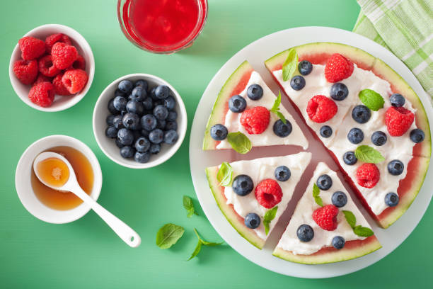 istock watermelon pizza slices with yogurt and berries, summer dessert 833739148