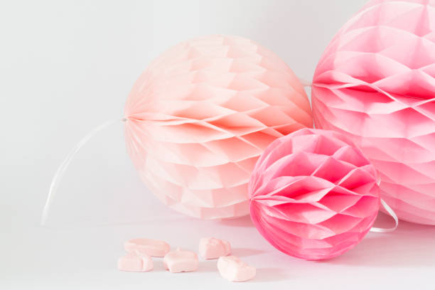 istock pink and salmon honeycombs with sweet candy against white background 833741928