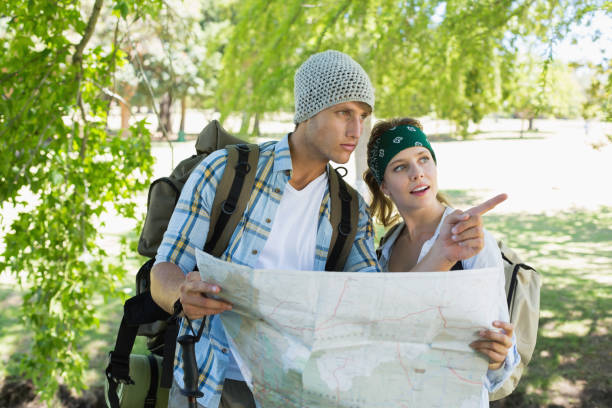 istock Active couple on a hike consulting the map 833741936
