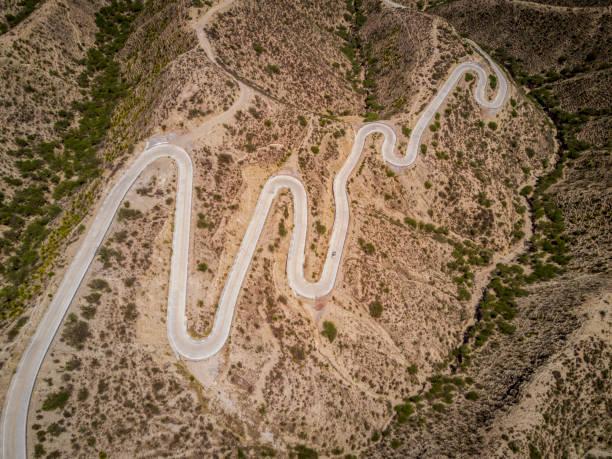 istock road over mountains aerial 833744950