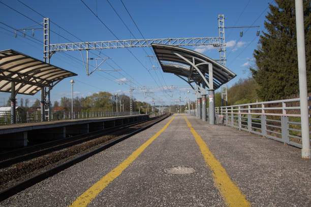 istock Railway station platform no people low angle shot blue sky 833747888